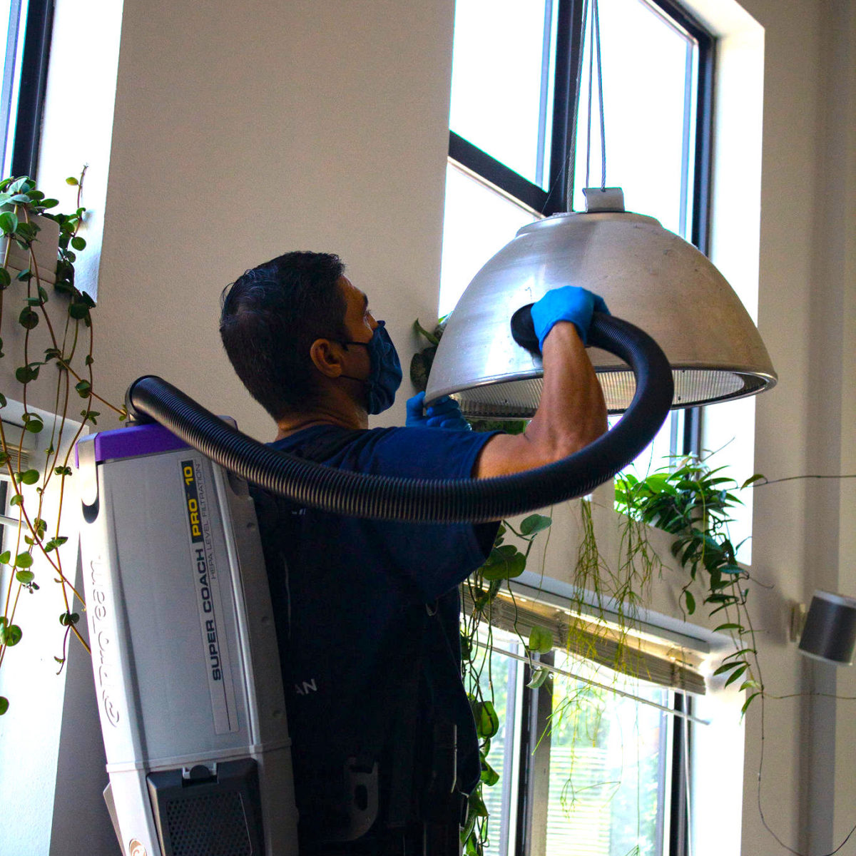 Cleaner deep cleaning an office.