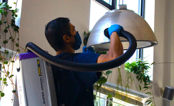 Cleaner deep cleaning an office.