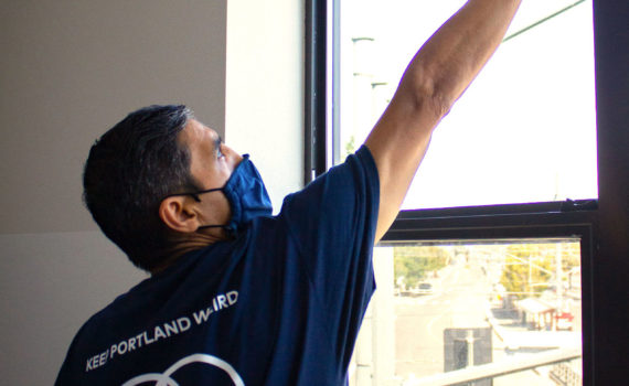 Cleaning office windows.