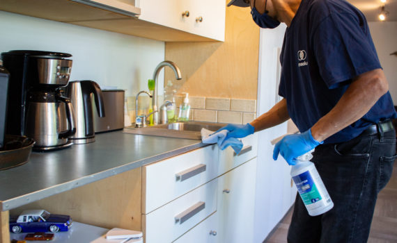 Cleaning break room kitchen.