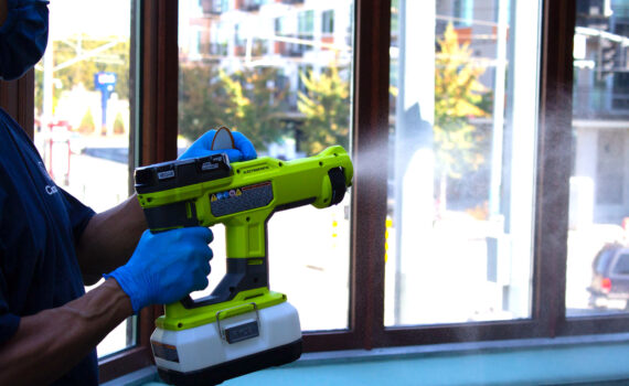 Cleaner using an electrostatic sprayer to prevent germs at the office.